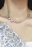 Collier rond rose avec strass coeur