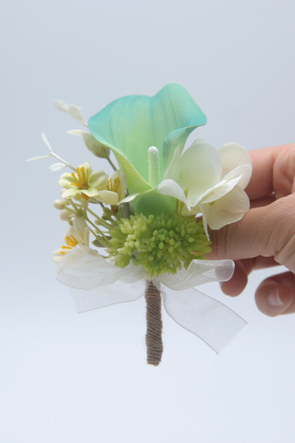 Boutonnière rose pour hommes pour bal de fin d’année
