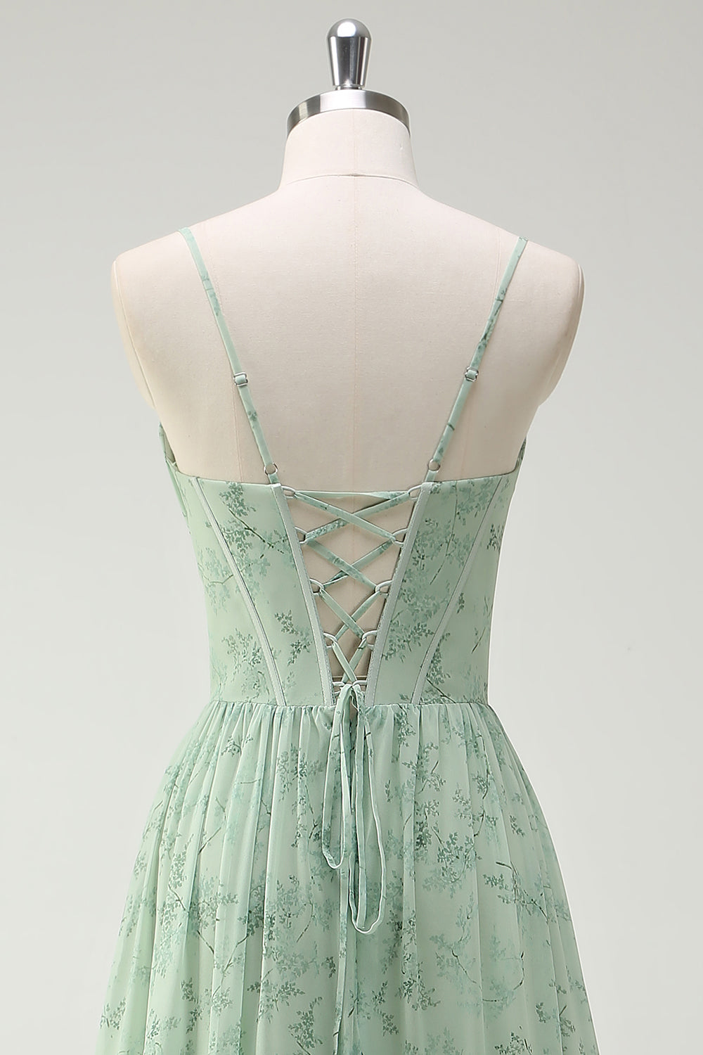 Robe de demoiselle d'honneur longue à bretelles spaghetti et imprimé floral vert avec fente