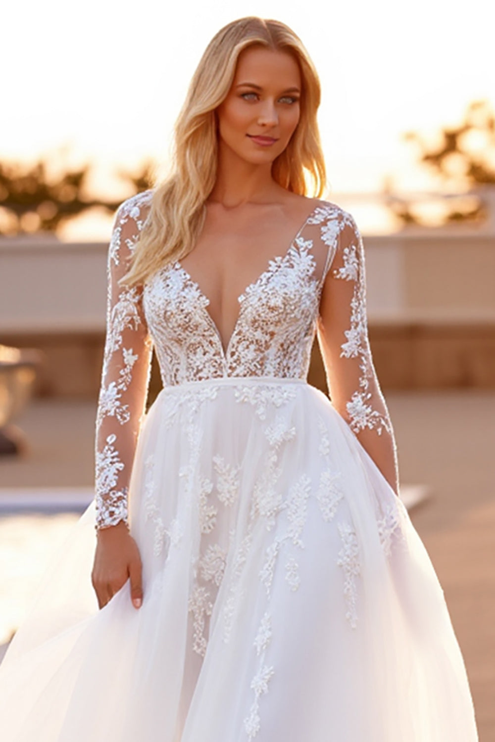 Robe de mariée blanche à manches longues