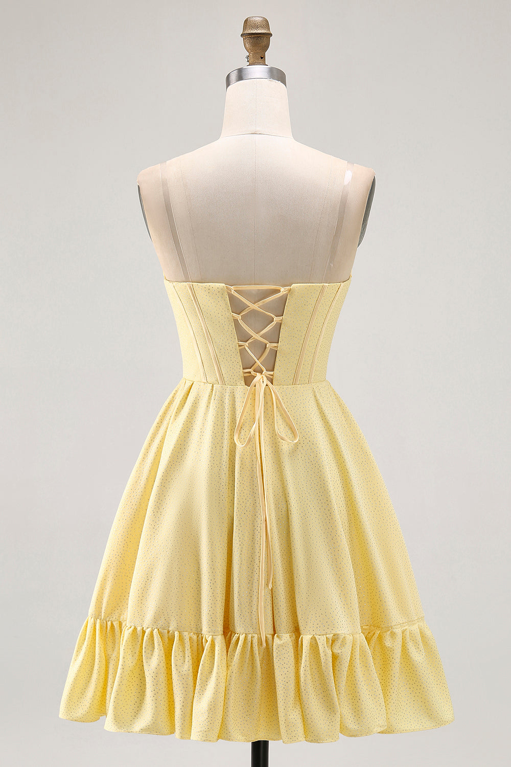 Robe de cocktail corset trapèze sans bretelles jaune avec perles
