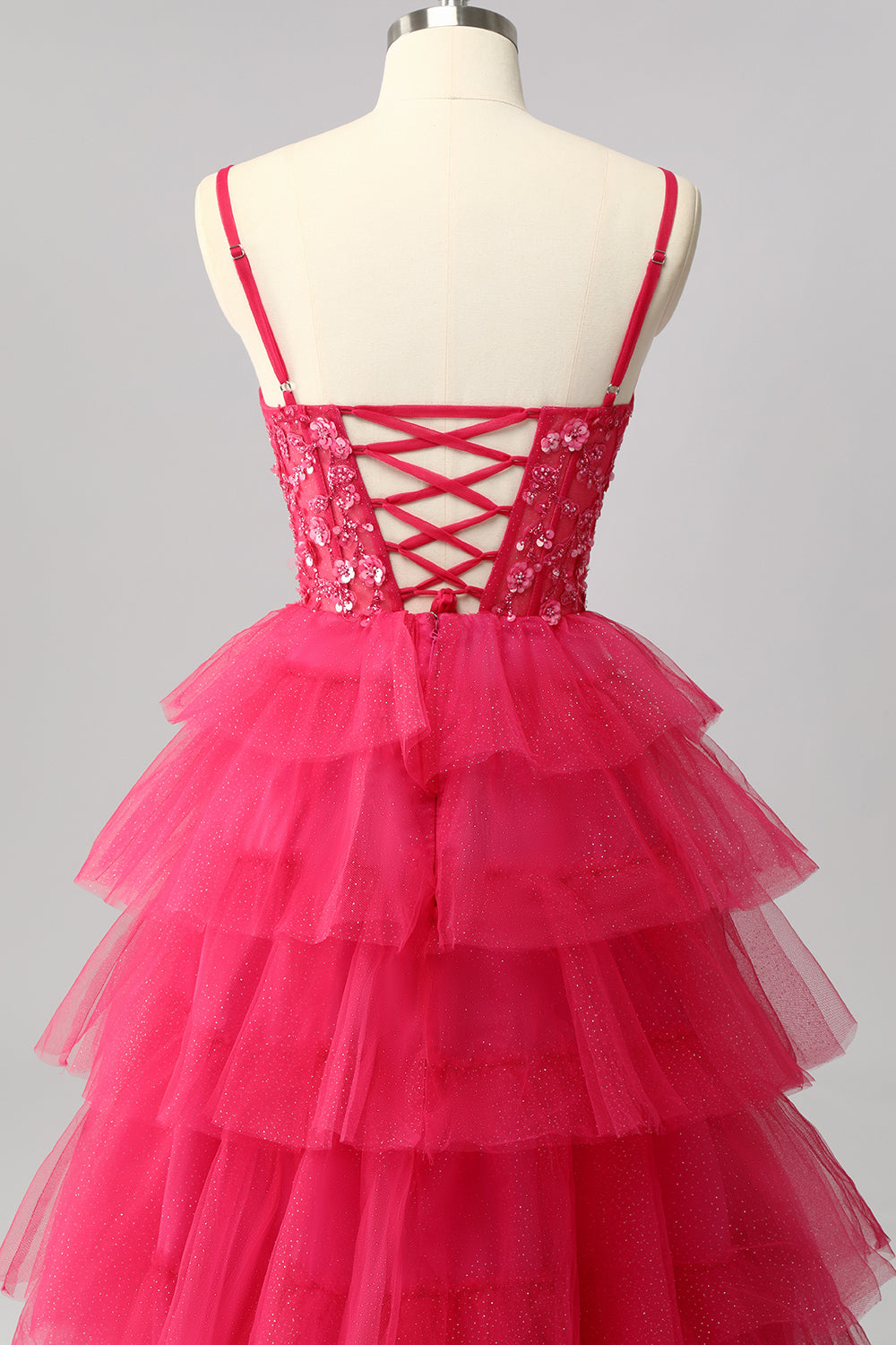 Robe de bal longue à plusieurs niveaux fuchsia scintillante avec appliques