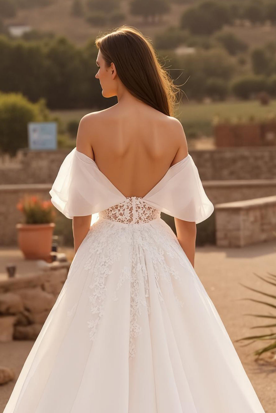 Robe de mariée longue corset en tulle ivoire à manches flottantes