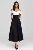 Robe longue formelle en satin noir et blanc à épaules dénudées avec poches