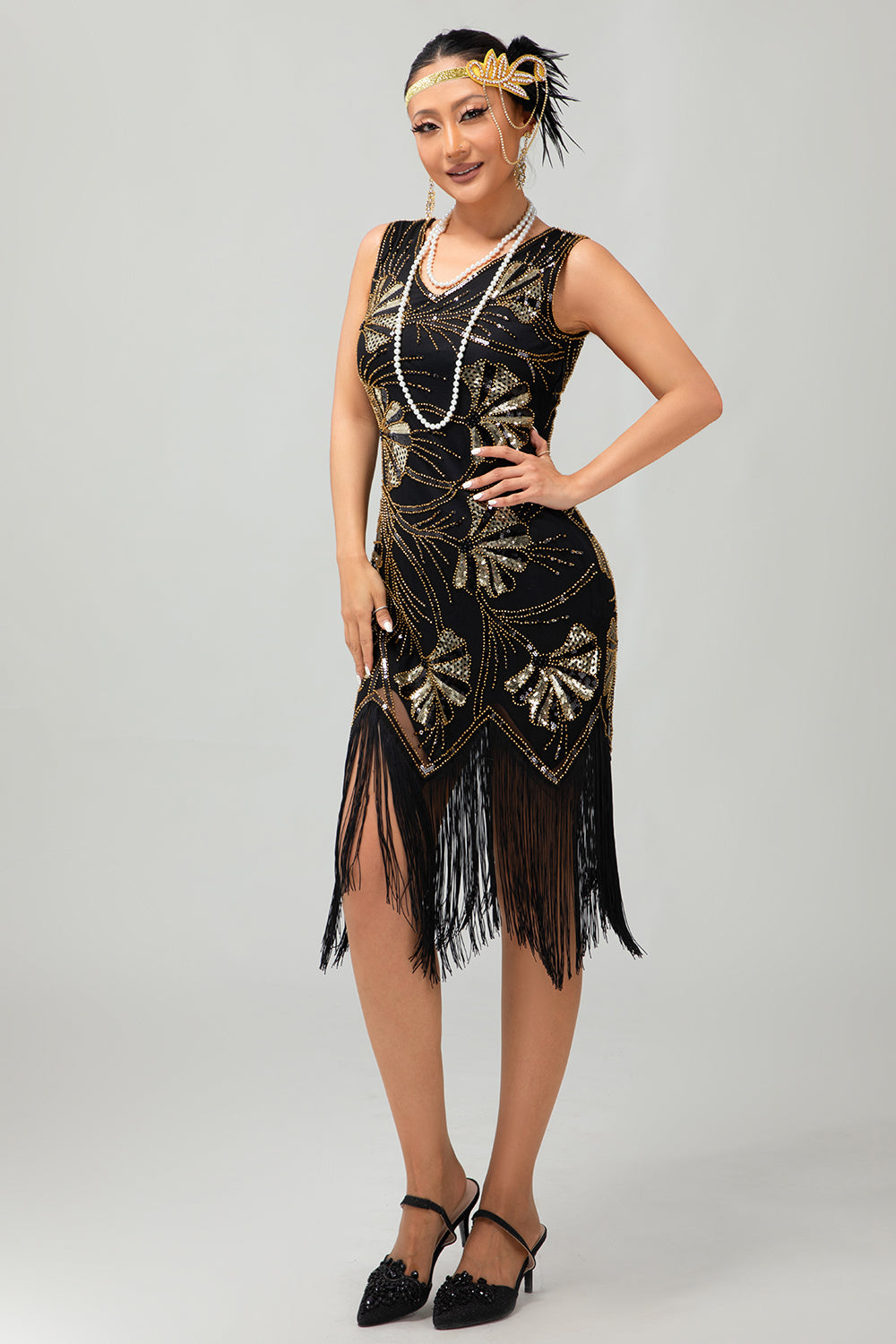 Robe noire scintillante à franges dorées des années 1920