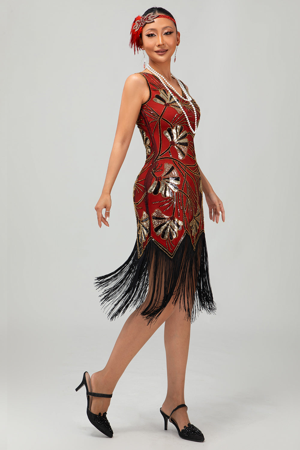 Robe noire scintillante à franges dorées des années 1920