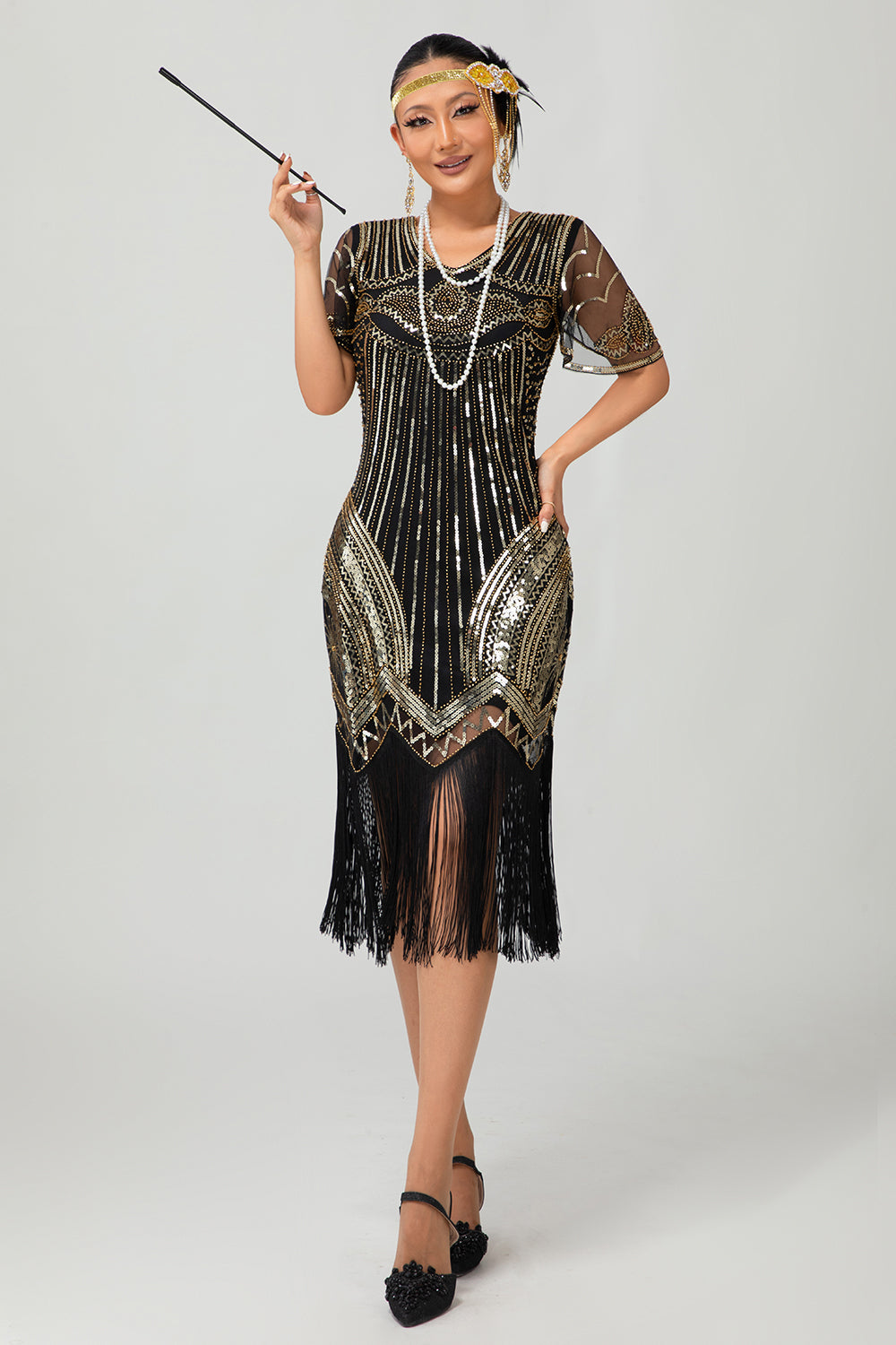 Robe moulante moulante à paillettes dorées noires des années 1920 avec pompons