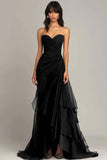 Robe noire à volants froncés