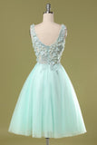 Robe de bal courte verte avec appliques