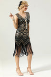 Robe à paillettes noires et dorées des années 1920