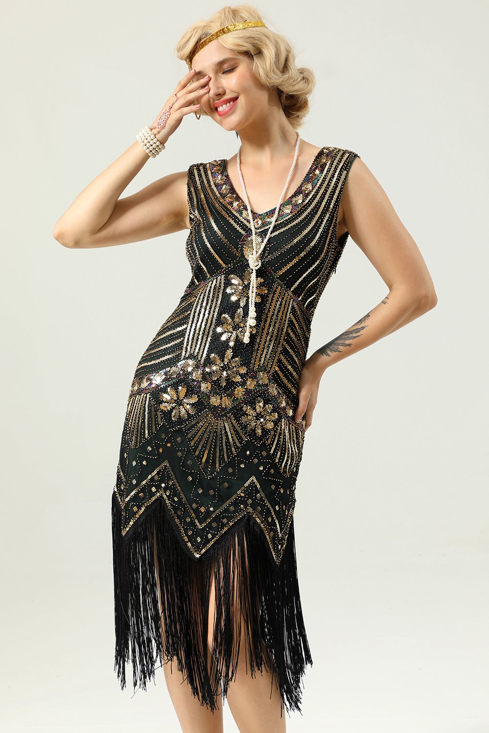 Robe à paillettes noires et dorées des années 1920