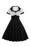 Robe noire à pois swing des années 50 à manches courtes