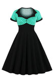 Robe noire à pois swing des années 50 à manches courtes