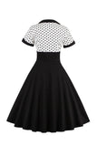 Robe noire à pois swing des années 50 à manches courtes
