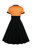 Robe noire à pois swing des années 50 à manches courtes
