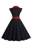 Robe noire à pois swing des années 50 avec nœud
