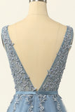 Robe de bal en tulle bleu avec appliques