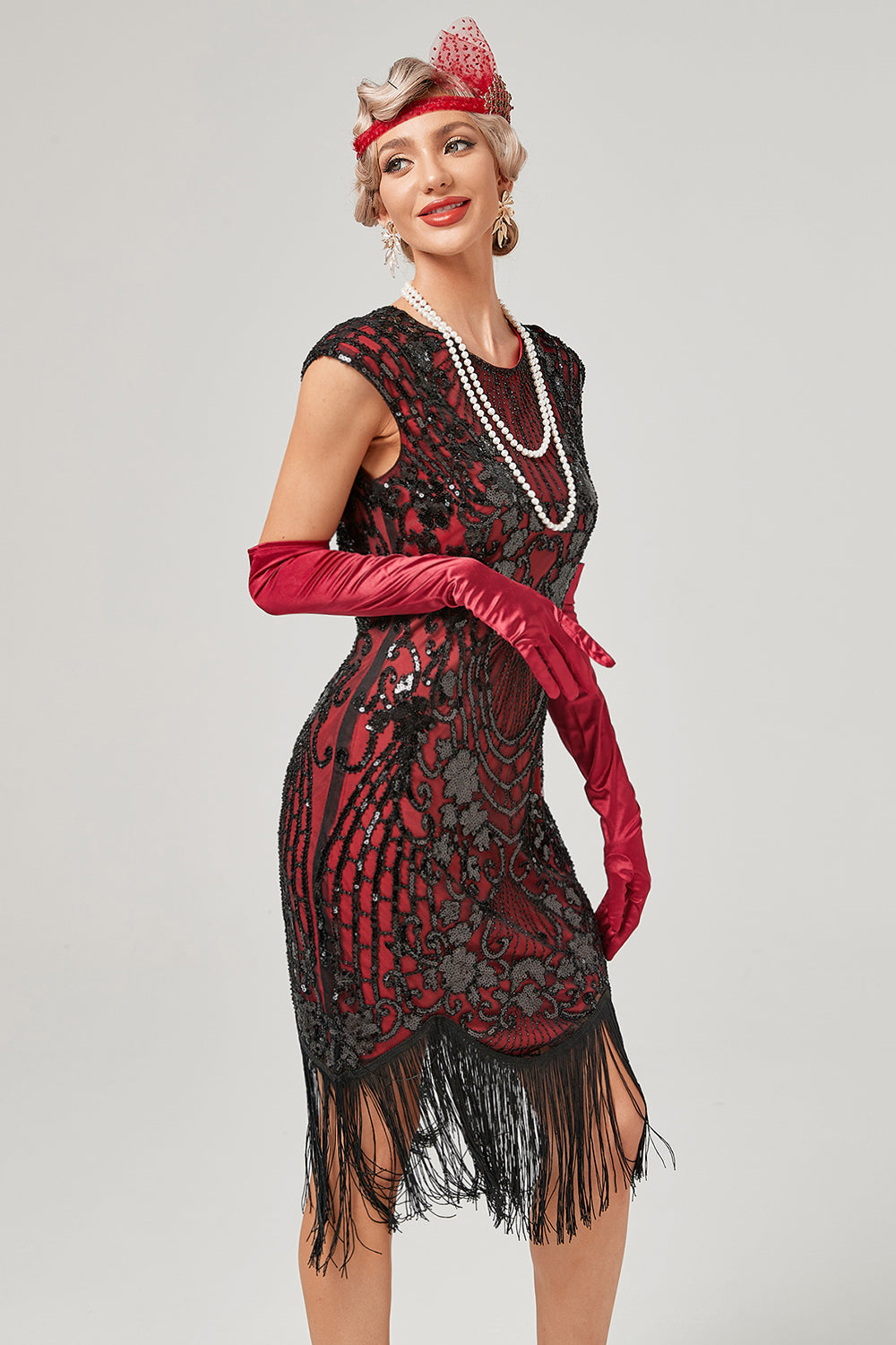 Broderie verte col rond broderie dorée des années 20 avec franges