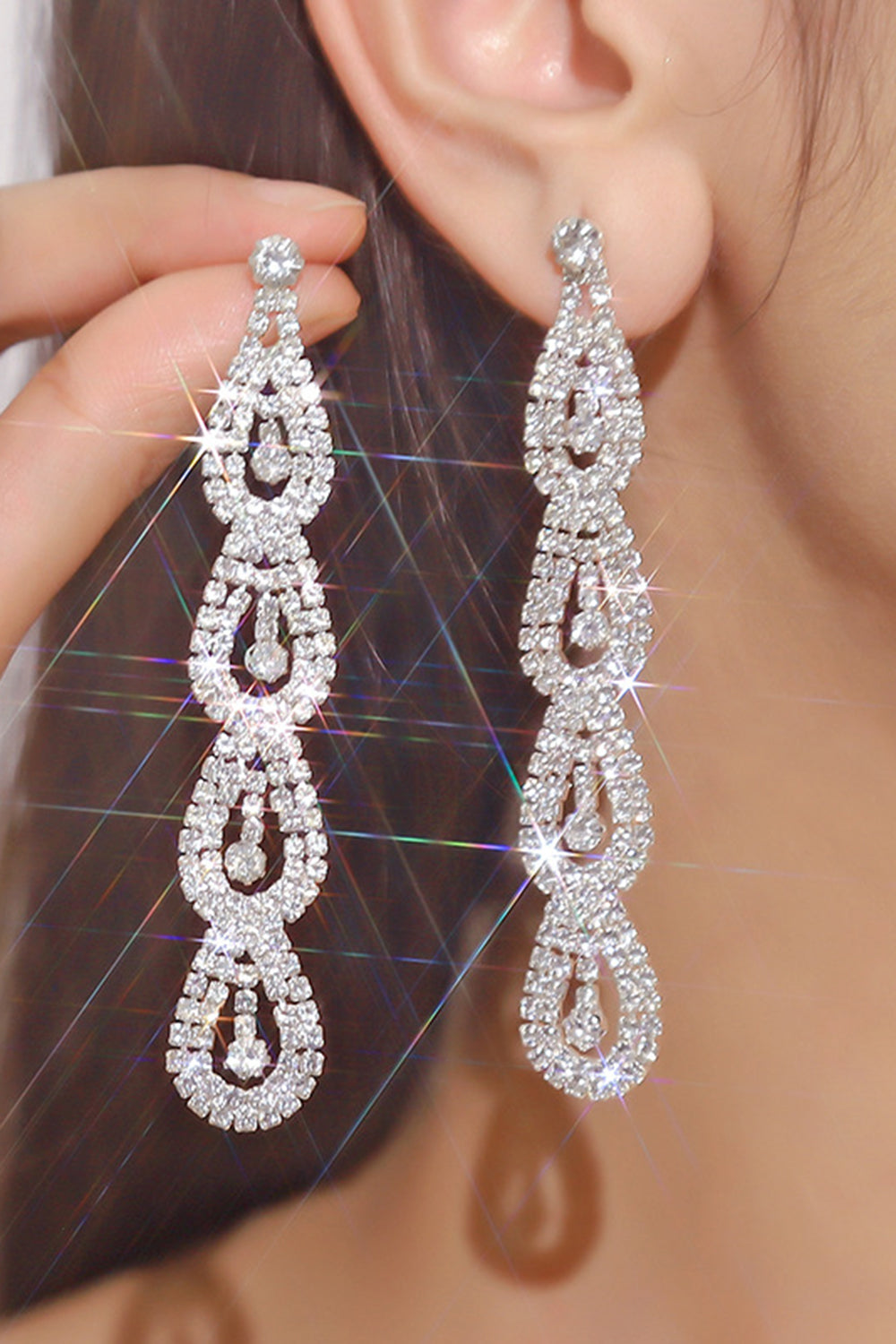 Boucles d’oreilles longues en strass argent