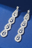 Boucles d’oreilles longues en strass argent