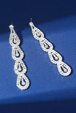 Boucles d’oreilles longues en strass argent