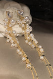 Perle d’or longues boucles d’oreilles