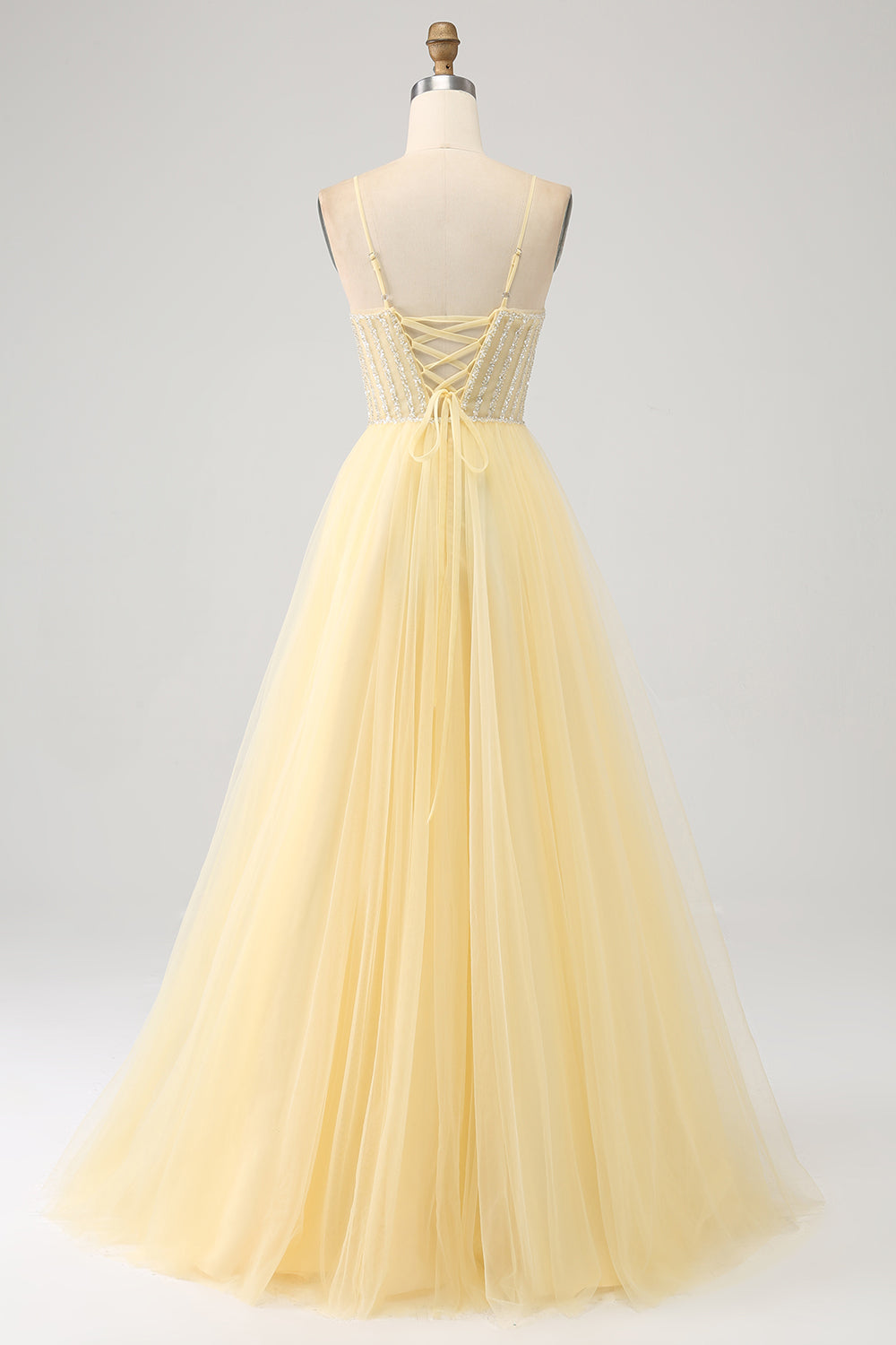 Robe de soirée jaune clair perlé en tulle avec fente