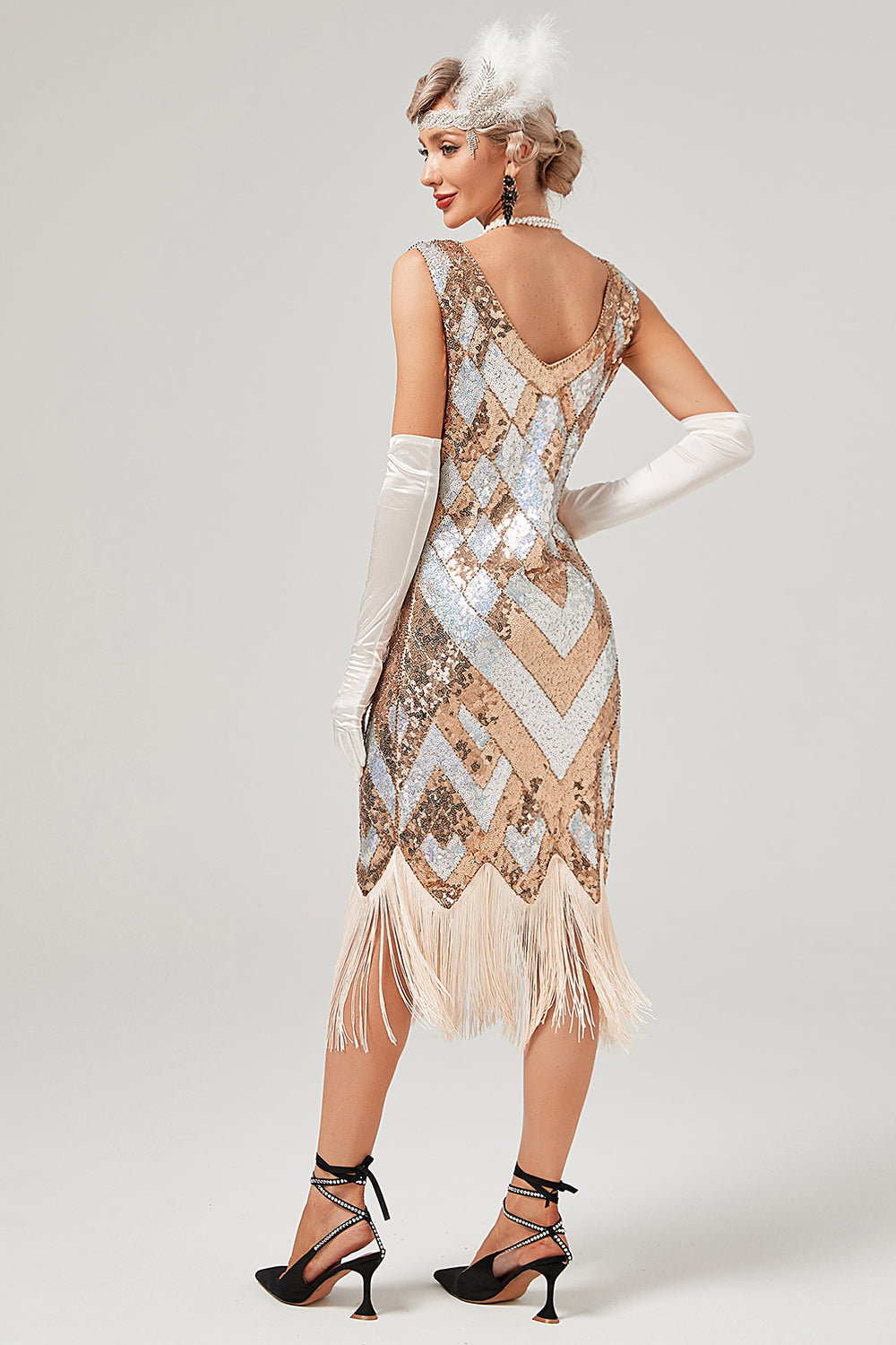 Robe à paillettes dorées des années 20 avec frange