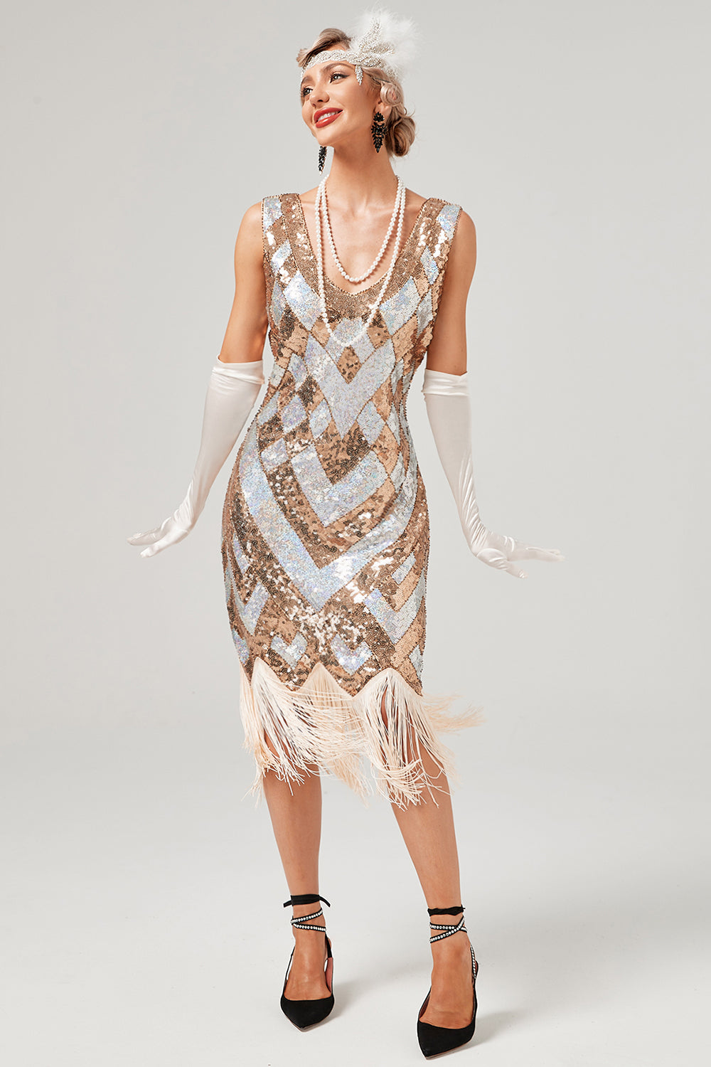 Robe à paillettes dorées des années 20 avec frange