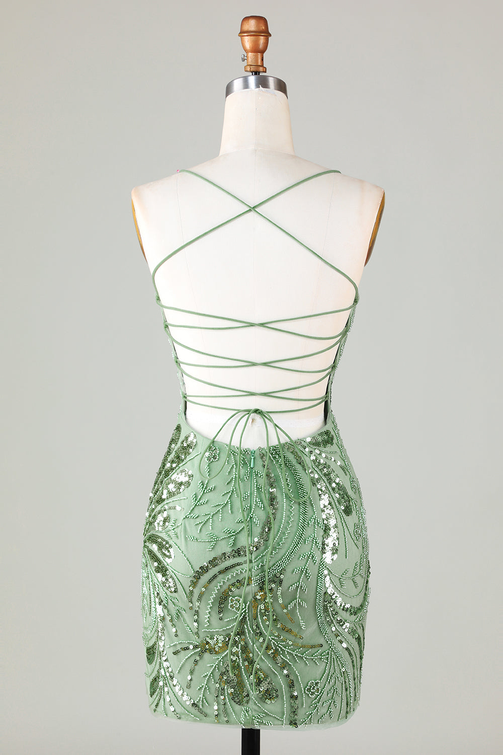 Robe de cocktail courte verte à bretelles spaghetti et gaine scintillante avec dos croisé