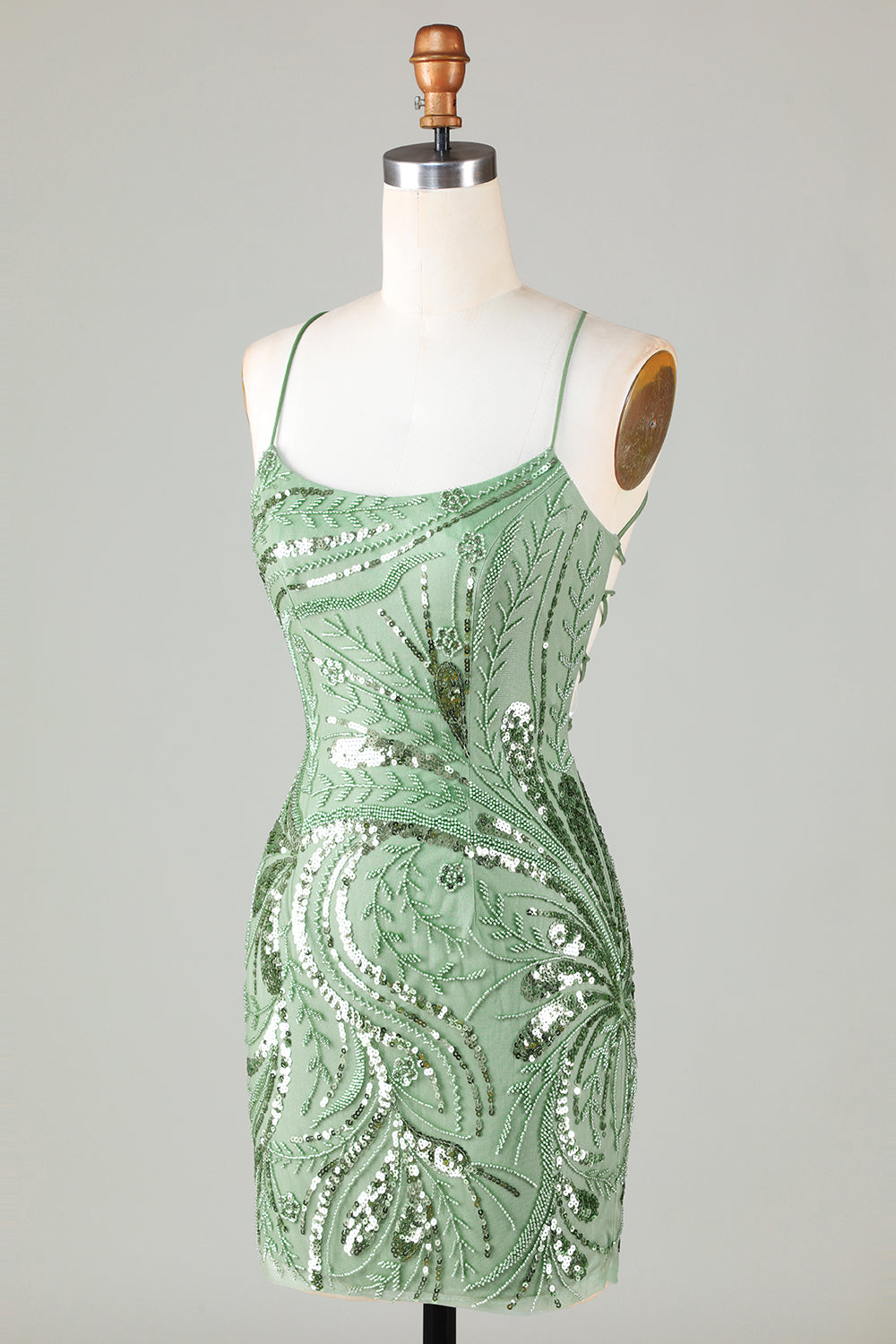 Robe de cocktail courte verte à bretelles spaghetti et gaine scintillante avec dos croisé