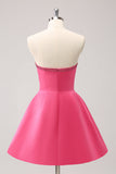 Robe bustier trapèze perlée fuchsia scintillante avec noeuds