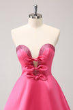 Robe bustier trapèze perlée fuchsia scintillante avec noeuds