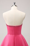 Robe bustier trapèze perlée fuchsia scintillante avec noeuds