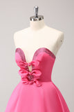 Robe bustier trapèze perlée fuchsia scintillante avec noeuds