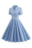 Robe bleue à revers trapèze vintage des années 1950 avec boutons