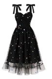 Robe vintage noire Pin Up des années 50 avec étoiles