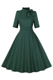 Robe vert foncé à col montant Vintage des années 1950