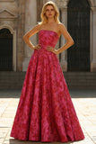 Robe de bal longue en brocart fleuri fûres fuchsia sans bustier