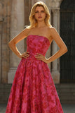 Robe de bal longue en brocart fleuri fûres fuchsia sans bustier