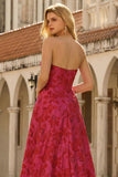 Robe de bal longue en brocart fleuri fûres fuchsia sans bustier