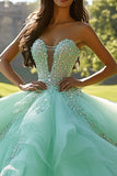 Robe de bal à volants menthe scintillante