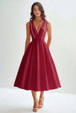 Robe mi-longue trapèze blanche en satin mat sans manches