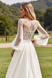 Robe de mariée en dentelle à manches longues ivoire avec appliques