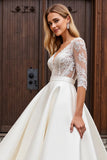 Une ligne demi-manches lvory dentelle robe de mariée longue