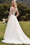 Une ligne appliquée à manches longues lvory robe de mariée plissée