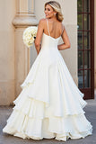Robe de mariée longue à volants à bretelles spaghetti trapèze blanche