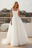 Robe de mariée en tulle crêpe ivoire à bretelles spaghetti