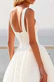 Robe de mariée en tulle crêpe ivoire à bretelles spaghetti
