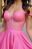 Robe de bal corset à épaules dénudées fuchsia à sequins